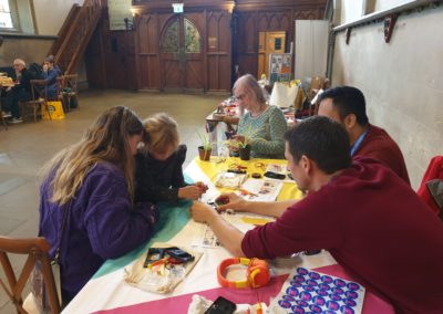 Young people learning repair skills with Team Repair kits at Dover Repair Cafe
