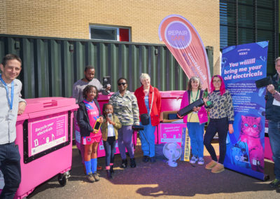 Bins and team from Maidstone Repair Cafe with some happy 'customers' and e-waste bins
