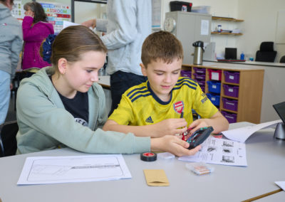 Students learning repair skills with Team Repair kits