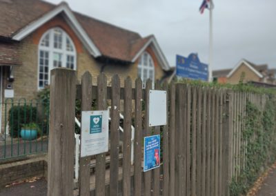 Poster advertising e-waste recycling on fence of school in Dover