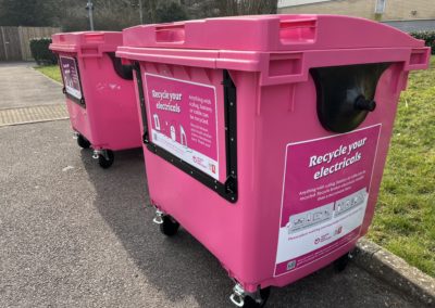 two pink e-waste bins